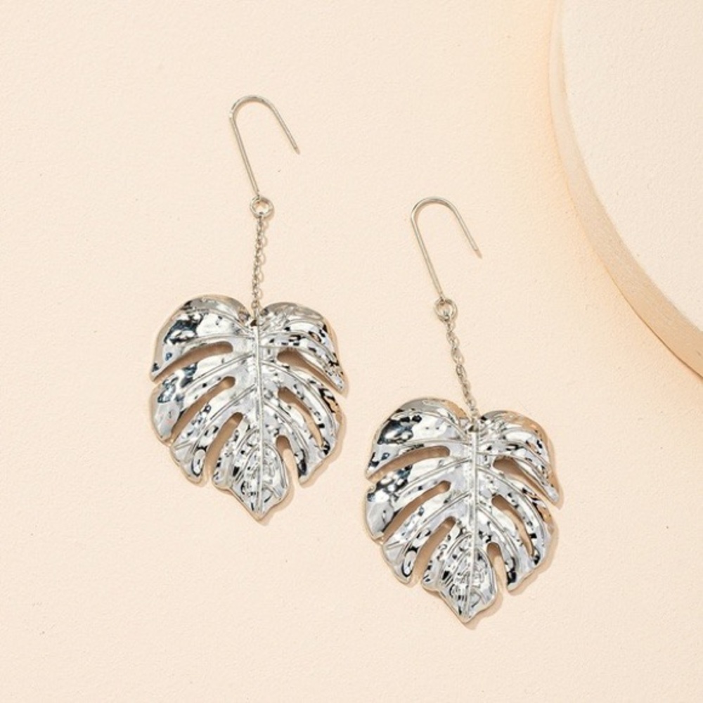 Silver monstera dangle earrings